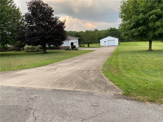 39 Hogue Rd, West Middlesex Boro, PA 16159 - view of front of home featuring a detached garage, a front lawn, and an outdoor structure