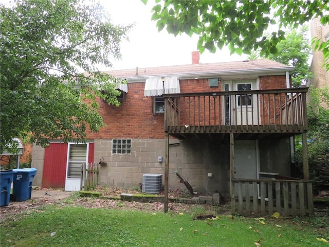 150 Marshall Dr, Penn Hills, PA 15235 - back of house with a wooden deck, a chimney, brick siding, and a yard