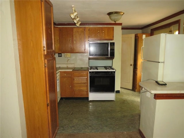 150 Marshall Dr, Penn Hills, PA 15235 - kitchen with gas range, freestanding refrigerator, brown cabinetry, crown molding, and dark flooring