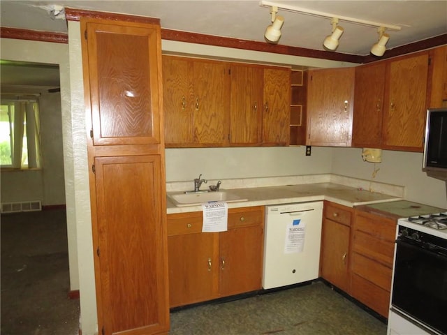 150 Marshall Dr, Penn Hills, PA 15235 - kitchen with dishwasher, gas range oven, light countertops, stainless steel microwave, and brown cabinets