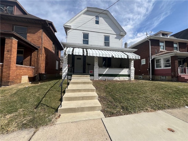 1320 Leishman Ave, New Kensington, PA 15068 - american foursquare style home with a front yard and a porch