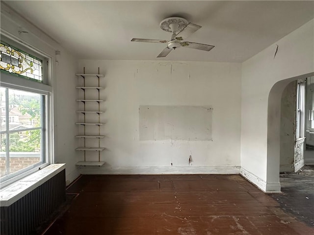 1532 Orangewood Ave, Beechview, PA 15216 - unfurnished room with radiator, arched walkways, ceiling fan, and hardwood / wood-style floors
