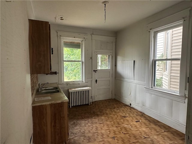 1532 Orangewood Ave, Beechview, PA 15216 - doorway featuring radiator heating unit, a wainscoted wall, and a decorative wall