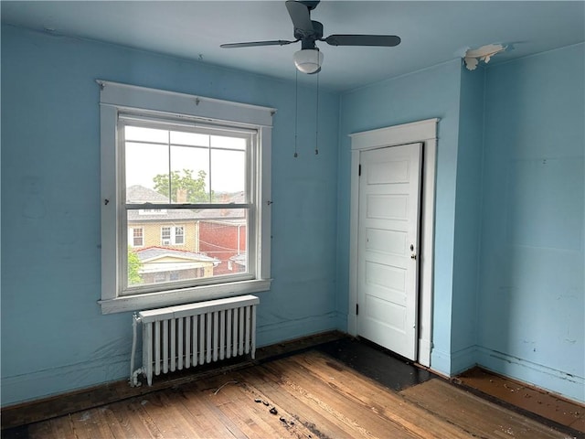 1532 Orangewood Ave, Beechview, PA 15216 - unfurnished room featuring radiator, hardwood / wood-style floors, and a ceiling fan