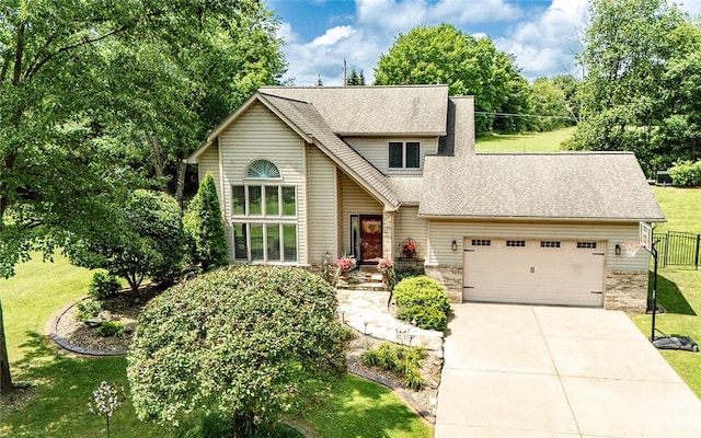 652 Cheyenne Trl, Jackson Twp, PA 16137 - view of front of house with a garage, driveway, and roof with shingles