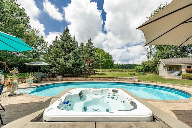 652 Cheyenne Trl, Jackson Twp, PA 16137 - outdoor pool with an outdoor hot tub, a patio, and an outdoor structure