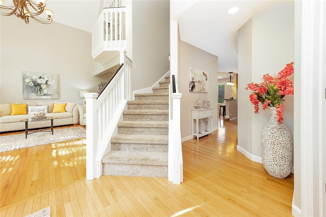 652 Cheyenne Trl, Jackson Twp, PA 16137 - staircase with hardwood / wood-style floors and a chandelier