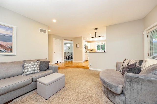 652 Cheyenne Trl, Jackson Twp, PA 16137 - living area with light colored carpet, recessed lighting, and plenty of natural light