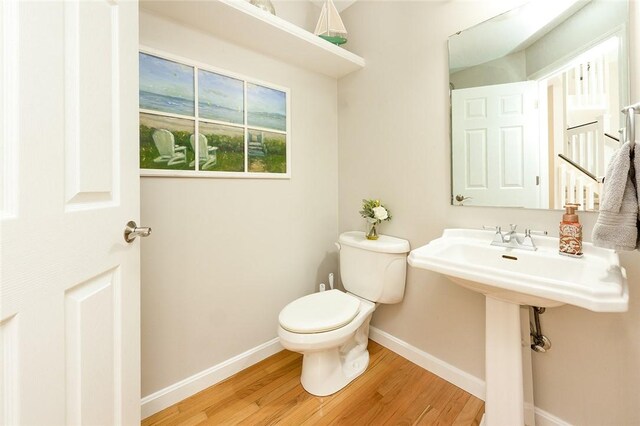 652 Cheyenne Trl, Jackson Twp, PA 16137 - half bathroom with wood finished floors and toilet