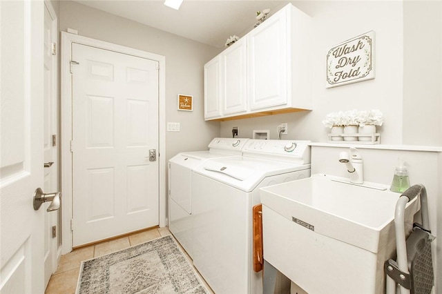 652 Cheyenne Trl, Jackson Twp, PA 16137 - washroom featuring separate washer and dryer, light tile patterned floors, and cabinet space