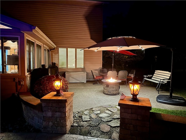 652 Cheyenne Trl, Jackson Twp, PA 16137 - view of patio featuring an outdoor fire pit
