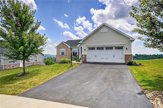 106 High Pointe Dr, Chartiers, PA 15301 - view of front of house featuring brick siding, asphalt driveway, a front yard, and a garage