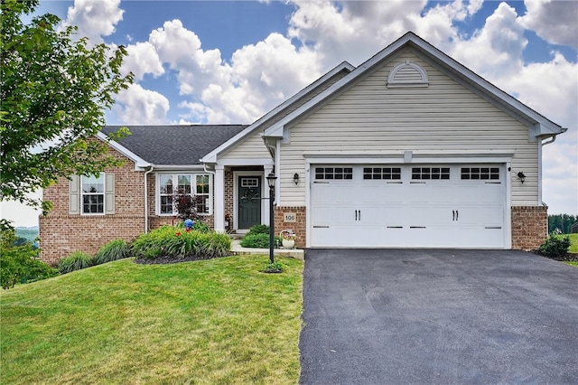 106 High Pointe Dr, Chartiers, PA 15301 - view of front of house with brick siding, driveway, a front yard, and a garage