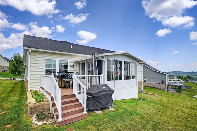106 High Pointe Dr, Chartiers, PA 15301 - back of property with a sunroom, a wooden deck, a yard, and a shingled roof