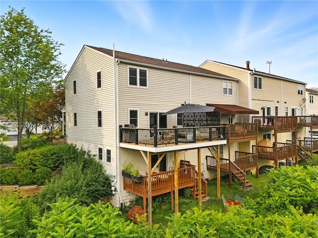 1206 Carla Dr, Blawnox, PA 15238 - rear view of house featuring a deck and stairway