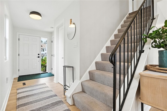 1206 Carla Dr, Blawnox, PA 15238 - foyer featuring stairs and light wood-style flooring