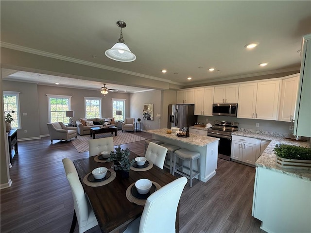 173 Lockheed Dr, Moon/Crescent Twp, PA 15108 - kitchen featuring appliances with stainless steel finishes, dark wood-style floors, white cabinetry, open floor plan, and recessed lighting