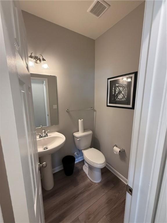 173 Lockheed Dr, Moon/Crescent Twp, PA 15108 - bathroom featuring toilet and wood finished floors