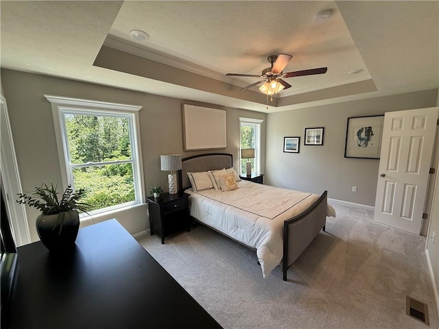 173 Lockheed Dr, Moon/Crescent Twp, PA 15108 - bedroom with a raised ceiling, light carpet, multiple windows, crown molding, and a ceiling fan