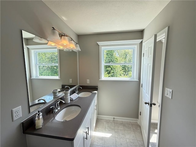173 Lockheed Dr, Moon/Crescent Twp, PA 15108 - full bathroom with double vanity, a textured ceiling, and marble finish flooring