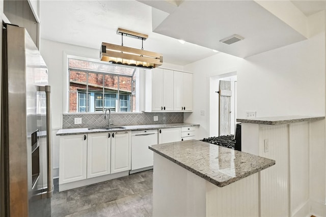 5248 Beelermont Pl, Squirrel Hill, PA 15217 - kitchen with white dishwasher, stainless steel fridge with ice dispenser, decorative backsplash, light stone countertops, and white cabinetry