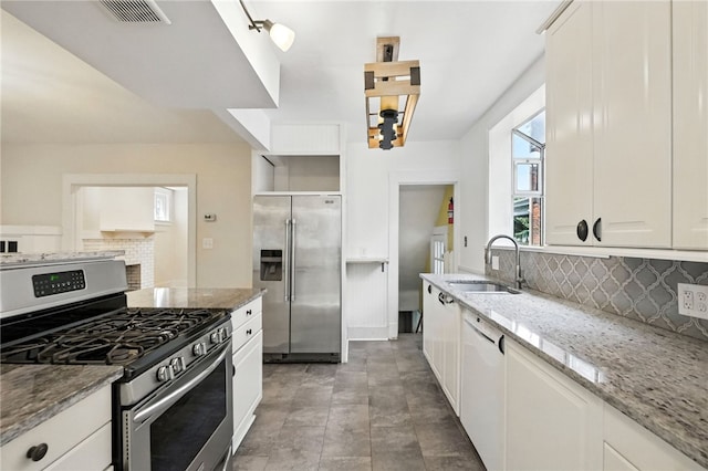 5248 Beelermont Pl, Squirrel Hill, PA 15217 - kitchen featuring appliances with stainless steel finishes, decorative backsplash, and light stone countertops