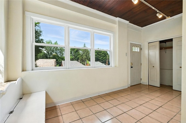 5248 Beelermont Pl, Squirrel Hill, PA 15217 - unfurnished bedroom featuring rail lighting, wooden ceiling, light tile patterned floors, a closet, and crown molding
