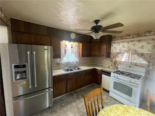 33 Orchard Ln, Carroll Twp, PA 15063 - kitchen featuring white appliances, light countertops, and ceiling fan