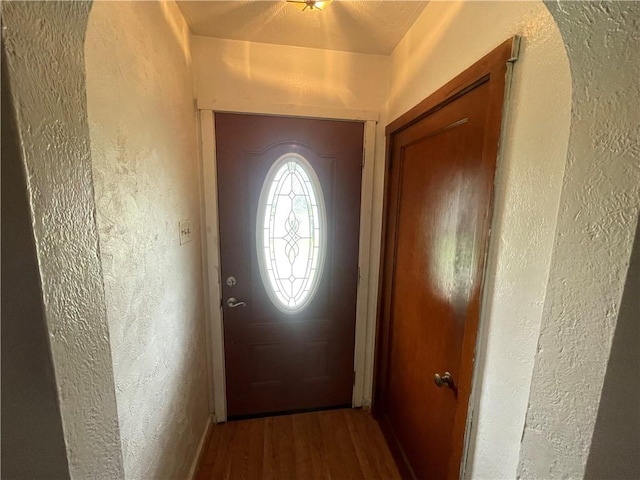 33 Orchard Ln, Carroll Twp, PA 15063 - doorway to outside with a textured wall and wood finished floors