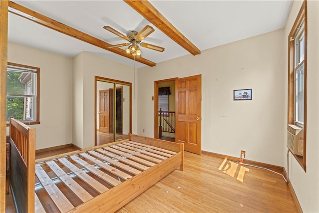 213 Pennsylvania Ave, Emsworth, PA 15202 - unfurnished bedroom featuring wood finished floors, beam ceiling, a closet, ceiling fan, and cooling unit