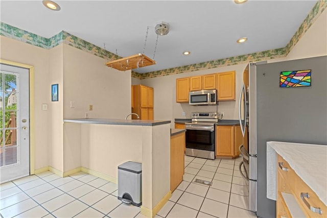 213 Pennsylvania Ave, Emsworth, PA 15202 - kitchen with appliances with stainless steel finishes, recessed lighting, light tile patterned flooring, a peninsula, and light brown cabinets