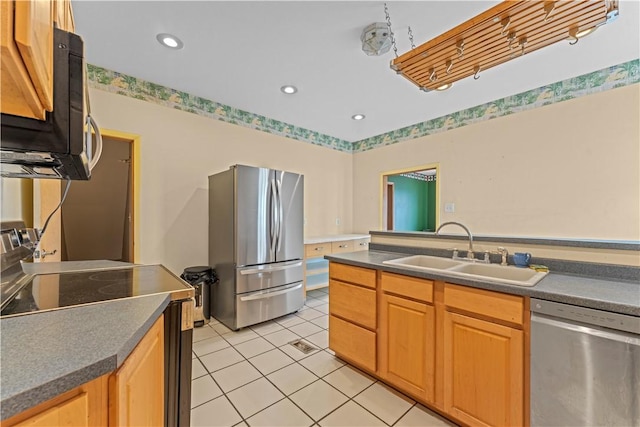 213 Pennsylvania Ave, Emsworth, PA 15202 - kitchen with stainless steel appliances, light tile patterned flooring, dark countertops, and recessed lighting