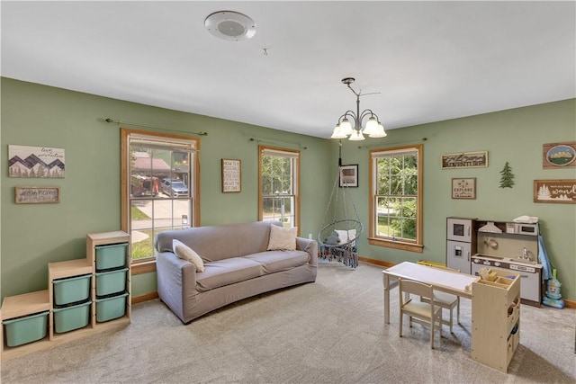 115 Barrett Dr, Brighton Twp, PA 15009 - carpeted living room with a chandelier and baseboards
