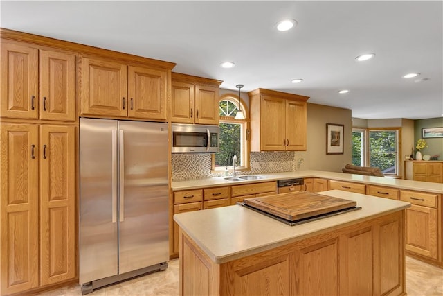 115 Barrett Dr, Brighton Twp, PA 15009 - kitchen with stainless steel appliances, light countertops, a center island, plenty of natural light, and recessed lighting