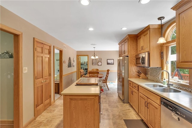 115 Barrett Dr, Brighton Twp, PA 15009 - kitchen featuring stainless steel appliances, a center island, a chandelier, pendant lighting, and light countertops