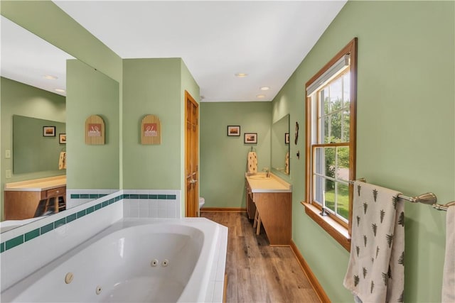 115 Barrett Dr, Brighton Twp, PA 15009 - full bath featuring plenty of natural light, a jetted tub, wood finished floors, vanity, and recessed lighting