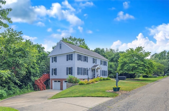 115 Barrett Dr, Brighton Twp, PA 15009 - colonial-style house featuring an attached garage, driveway, stairs, and a front yard
