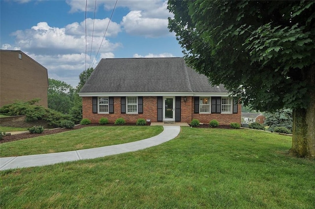 79 W Manilla Ave, Green Tree, PA 15220 - view of front facade with brick siding, a front lawn, and a shingled roof