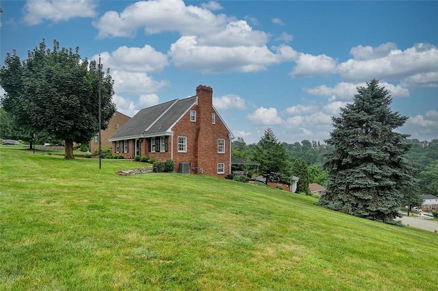 79 W Manilla Ave, Green Tree, PA 15220 - view of property exterior with a yard, a chimney, and brick siding