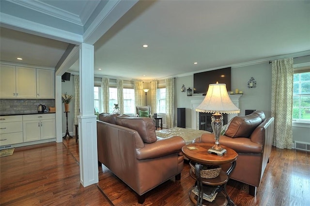79 W Manilla Ave, Green Tree, PA 15220 - living room with ornamental molding, dark wood-style flooring, a glass covered fireplace, and recessed lighting