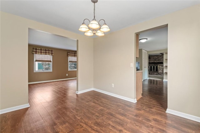 1308 Heather Heights Dr, Mccandless, PA 15101 - unfurnished room featuring a chandelier, dark wood-style floors, and a fireplace