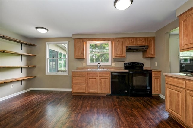 1308 Heather Heights Dr, Mccandless, PA 15101 - kitchen with black appliances, under cabinet range hood, light countertops, and dark wood-style floors