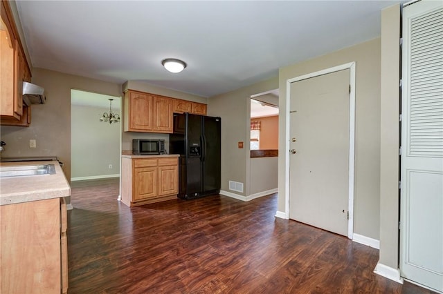 1308 Heather Heights Dr, Mccandless, PA 15101 - kitchen with black appliances, light countertops, dark wood-style floors, exhaust hood, and light brown cabinetry