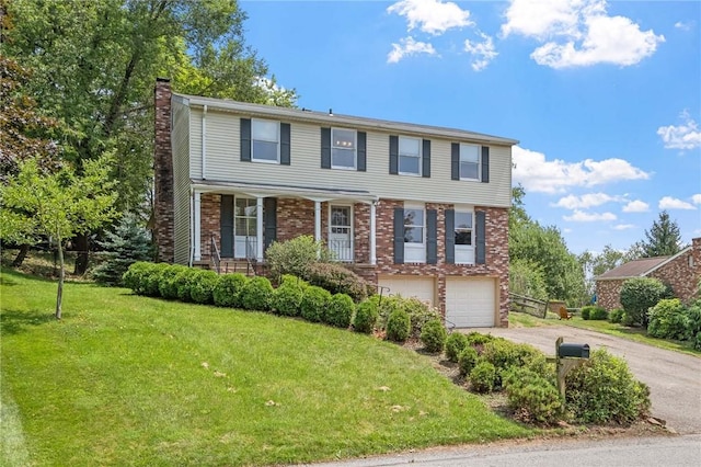 1308 Heather Heights Dr, Mccandless, PA 15101 - view of front facade featuring asphalt driveway, a chimney, a garage, brick siding, and a front lawn