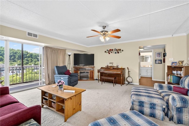 2120 Greentree Rd Unit 610E, Pittsburgh, PA 15220 - carpeted living area featuring ornamental molding, ceiling fan, and a textured ceiling