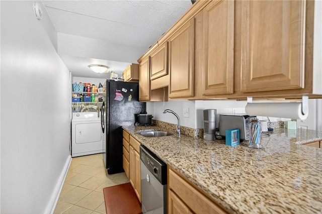 2120 Greentree Rd Unit 610E, Pittsburgh, PA 15220 - kitchen with stainless steel dishwasher, light tile patterned floors, light stone countertops, freestanding refrigerator, and washer and dryer