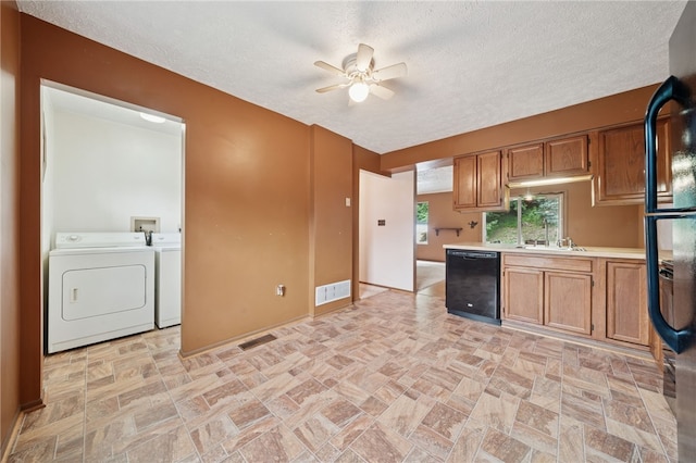 437 Shady Ridge Dr, Monroeville, PA 15146 - kitchen with dishwasher, washing machine and clothes dryer, a ceiling fan, light countertops, and a textured ceiling