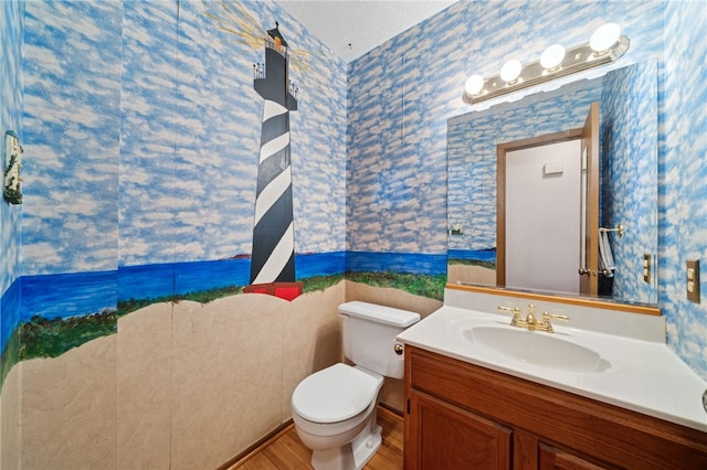 437 Shady Ridge Dr, Monroeville, PA 15146 - bathroom featuring wallpapered walls, vanity, and wood finished floors