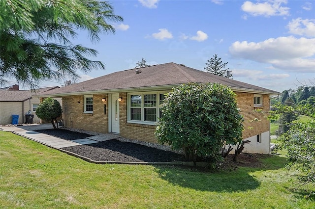 900 N Whitmore Rd, North Huntingdon, PA 15642 - rear view of house featuring a lawn and brick siding