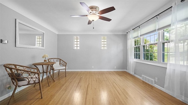900 N Whitmore Rd, North Huntingdon, PA 15642 - living area featuring light wood-type flooring and ceiling fan